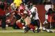 San Francisco 49ers running back Frank Gore (21) fumbles as he is tackled by Chicago Bears cornerback Charles Tillman (33) in the fourth quarter of an NFL football game in San Francisco, Thursday, Nov. 12, 2009. The 49ers recovered the fumble to retain possession. (AP Photo/Marcio Jose Sanchez)