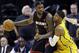 Miami Heat forward LeBron James, left, is defended by Indiana Pacers forward Paul George in the second half of an NBA basketball game in Indianapolis, Tuesday, Dec. 10, 2013. The Pacers won 90-84. (AP Photo/Michael Conroy)