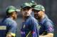 Pakistan’s Mohammad Hafeez, center, and coach Moin Khan, right, attend a team practice session in Dhaka, Bangladesh, Friday, March 7, 2014. Pakistan will face Sri Lanka in the Asia Cup final match on Saturday, March 8. (AP Photo/A.M. Ahad)