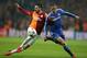Hakan Balta of Galatasaray, left, and Fernando Torres of Chelsea fight for the ball during their Champions League Round of 16, First Leg soccer match between Galatasaray and Chelsea at Turk Telekom Arena Stadium in Istanbul, Turkey, Wednesday, Feb. 26, 2014. (AP Photo)