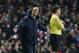 Arsenal's manager Arsene Wenger, left, gestures to the fourth official about a referee decision during their English Premier League soccer match against Hull City at Emirates Stadium in London, Wednesday, Dec. 4, 2013. (AP Photo/Sang Tan)