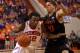 Mar 4, 2014; Clemson, SC, USA; Clemson Tigers guard Rod Hall (12) drives to the basket while being defended by Miami Hurricanes guard Manu Lecomte (20) during the second half at J.C. Littlejohn Coliseum. Tigers won 58-54. Mandatory Credit: Joshua S. Kelly-USA TODAY Sports