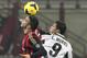 AC Milan defender Adil Rami, left, of France, challenges for the ball with Udinese forward Luis Muriel, of Colombia, during their Italian Cup soccer match, at the San Siro stadium in Milan, Italy, Wednesday, Jan. 22, 2014. (AP Photo/Antonio Calanni)
