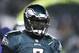 Philadelphia Eagles' Michael Vick warms up before an NFL wild-card playoff football game against the New Orleans Saints, Saturday, Jan. 4, 2014, in Philadelphia. (AP Photo/Julio Cortez)