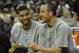 Mar 4, 2014; Cleveland, OH, USA; San Antonio Spurs power forward Tim Duncan (left) and shooting guard Manu Ginobili (20) laugh on the bench in the fourth quarter of a 122-101 win over the Cleveland Cavaliers at Quicken Loans Arena. Mandatory Credit: David Richard-USA TODAY Sports
