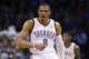 Oklahoma City Thunder guard Russell Westbrook (0) gestures following a three point basket in the second quarter of an NBA basketball game against the Philadelphia 76ers in Oklahoma City, Tuesday, March 4, 2014. (AP Photo/Sue Ogrocki)