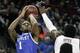 Kentucky's James Young (1) hits his shot as South Carolina's Duane Notice tries to defend during the first half of an NCAA college basketball game Saturday March 1, 2014 in Columbia, S.C. (AP Photo/Mary Ann Chastain)