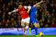LONDON, ENGLAND - DECEMBER 08: Mesut Oezil of Arsenal and Seamus Coleman of Everton battle for the ball during the Barclays Premier League match between Arsenal and Everton at Emirates Stadium on December 8, 2013 in London, England. (Photo by Michael Regan/Getty Images)