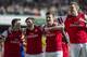 Arsenal's Olivier Giroud, second right, celebrates with teammates Mesut Ozil left, Tomas Rosicky, second left, and Per Mertesacker , right, after scoring against Everton, during their FA Cup quarterfinal soccer match, at Emirates Stadium, in London, Saturday, March 8, 2014. (AP Photo/Bogdan Maran)