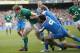 Ireland's Andrew Trimble, left, breaks through to score a try despite being tackled by Italy's Tito Tebaldi, right, and Joshua Raffaele Furno during their Six Nations Rugby Union international match at the Aviva Stadium, Dublin, Ireland, Saturday, March 8, 2014. (AP Photo/Peter Morrison)