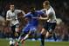 Chelsea's Samuel Eto'o, center, competes with Tottenham Hotspur's Michael Dawson, right, during their English Premier League soccer match at Stamford Bridge, London, Saturday, March 8, 2014. (AP Photo/Sang Tan)