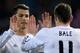 MADRID, SPAIN - FEBRUARY 11: Cristiano Ronaldo (L) of Real Madrid CF clashes hands with his teammate Gareth Bale (R) after a penalty over Bale during the Copa del Rey semi-final second leg match between Club Atletico de Madrid and Real Madrid CF at Vicente Calderon Stadium on February 11, 2014 in Madrid, Spain. (Photo by Gonzalo Arroyo Moreno/Getty Images)