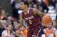 Nov 12, 2013; Syracuse, NY, USA; Fordham Rams guard Branden Frazier (0) moves the ball with Syracuse Orange forward C.J. Fair (5) defending during the second half of a game at the Carrier Dome. Syracuse won the game 89-74. Mandatory Credit: Mark Konezny-USA TODAY Sports