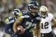 Seattle Seahawks' defensive end Michael Bennett returns a fumble for a touchdown against the New Orleans Saints in the first half of an NFL football game, Monday, Dec. 2, 2013, in Seattle. (AP Photo/Elaine Thompson)