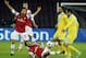 Arsenal's Arteta, center, goes for the ball as teammate Mathieu Flamini, left, Napolis' Goran Pandev, right, and Gonzalo Higuain, second right, wacth him, during a Champions League, group F, soccer match at the Naples San Paolo stadium, Italy, Wednesday, Dec. 11, 2013. (AP Photo/Salvatore Laporta)