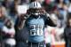 Tennessee Titans running back Chris Johnson pulls on his helmet in the second quarter of an NFL football game against the Houston Texans Sunday, Dec. 29, 2013, in Nashville, Tenn. (AP Photo/Wade Payne)