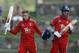 England's Joe Root, left, celebrates after he scored a century next to team's captain Stuart Broad during a tour match against University of West Indies' Vice Chancellor XI at the Sir Vivian Richards Cricket Ground in St. John's, Antigua, Tuesday, Feb. 25, 2014. (AP Photo/Ricardo Mazalan)
