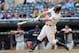 Aug 14, 2013; Minneapolis, MN, USA; Minnesota Twins catcher Joe Mauer (7) hits a home run in the tenth inning against the Cleveland Indians at Target Field. The Indians won 9-8 in 12 innings. Mandatory Credit: Jesse Johnson-USA TODAY Sports