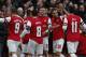 Arsenal's Alex Oxlade-Chamberlain, second left, celebrates his goal against Liverpool with teammates during their English FA Cup fifth round soccer match at Emirates Stadium in London, Sunday, Feb. 16, 2014. (AP Photo/Sang Tan)