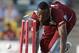 West Indies' Andre Russell runs out England's James Tredwell during their first T20 International cricket match at the Kensington Oval in Bridgetown, Barbados, Sunday, March 9, 2014. (AP Photo/Ricardo Mazalan)