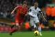 LIVERPOOL, ENGLAND - FEBRUARY 23: Jon Flanagan of Liverpool battles with Wayne Routledge of Swansea City during the Barclays Premier League match between Liverpool and Swansea City at Anfield on February 23, 2014 in Liverpool, England. (Photo by Clive Brunskill/Getty Images)