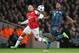 Arsenal's Alex Oxlade-Chamberlain, left, challenges Bayern's David Alaba during a Champions League, round of 16, first leg soccer match between Arsenal and Bayern Munich at the Emirates stadium in London, Wednesday, Feb. 19, 2014. (AP Photo/Alastair Grant)