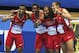 United States relay team with Kylie Clemons, Calvon Smith, David Verburg and Kind Butler III, from left, celebrate after winning the 4x400m relay with a new world record during the Athletics World Indoor Championships in Sopot, Poland, Sunday, March 9, 2014. (AP Photo/Petr David Josek)