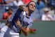 Roger Federer, of Switzerland, serves to Dmitry Tursunov, of Russia, during a third round match at the BNP Paribas Open tennis tournament, Monday, March 10, 2014 in Indian Wells, Calif. (AP Photo/Mark J. Terrill)