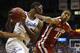 LAWRENCE, KS - FEBRUARY 24: Joel Embiid #21 of the Kansas Jayhawks grabs a rebound against Isaiah Cousins #11 of the Oklahoma Sooners in the first half at Allen Fieldhouse on February 24, 2014 in Lawrence, Kansas. (Photo by Ed Zurga/Getty Images)