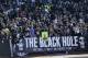 Oakland Raiders fans sit in the The Black Hole section of O.co Coliseum during the first half of an NFL football game against the Denver Broncos in Oakland, Calif., Sunday, Dec. 29, 2013. (AP Photo/Marcio Jose Sanchez)