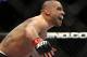 Renan Barao celebrates after beating Urijah Faber of Sacramento, CA during the first round of the Ultimate Fighting Bantamweight Championship Mixed Martial Arts bout in Newark, N.J. on Saturday, Feb. 1, 2014. Barao won after referee Herb Dean called the fight in the first round. (AP Photo/Tim Larsen)