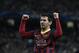 Barcelona's Lionel Messi celebrates after he scores the first goal of the game from a penalty during the Champions League first knock out round soccer match between Barcelona and Manchester City at the Etihad Stadium, Manchester, England, Tuesday Feb. 18, 2014. (AP Photo/Jon Super)