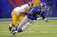 New York Giants quarterback Eli Manning (10) is sacked by Washington Redskins' Perry Riley (56) during the first half of an NFL football game Sunday, Dec. 29, 2013, in East Rutherford, N.J. (AP Photo/Bill Kostroun)