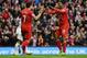 LIVERPOOL, ENGLAND - FEBRUARY 23: Daniel Sturridge of Liverpool celebrates scoring his team's third goal with Luis Suarez during the Barclays Premier League match between Liverpool and Swansea City at Anfield on February 23, 2014 in Liverpool, England. (Photo by Clive Brunskill/Getty Images)