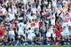 England's Luther Burrell, center, celebrates with his teammates after scoring a try against Wales during the Six Nations Rugby Union match between England and Wales at Twickenham stadium in London Sunday, March, 9, 2014. (AP Photo/Alastair Grant)