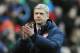 Arsenal manager Arsene Wenger applauds fans after the English Premier League soccer match between Stoke City and Arsenal at Britannia Stadium in Stoke On Trent, England, Saturday, March 1, 2014. (AP Photo/Rui Vieira)