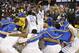 Delaware's Devon Saddler, center left, and Jarvis Threatt are introduced before playing William and Mary in the CAA Championship basketball game Monday, March 10, 2014, in Baltimore. (AP Photo/Gail Burton)