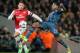 Arsenal's Alex Oxlade-Chamberlain, left, and Bayern's David Alaba challenge for the ball during a Champions League, round of 16, first leg soccer match between Arsenal and Bayern Munich at the Emirates stadium in London, Wednesday, Feb. 19, 2014 .(AP Photo/Alastair Grant)