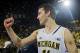 Michigan guard Nik Stauskas (11) cheers after an NCAA college basketball game against Indiana in Ann Arbor, Mich., Saturday, March 8, 2014. Michigan won 84-80. (AP Photo/Tony Ding)
