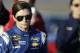 Danica Patrick walks down pit row following qualifying for Sunday's NASCAR Sprint Cup Series auto race, Friday, March 7, 2014, in Las Vegas. (AP Photo/Isaac Brekken)
