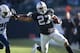 OAKLAND, CA - NOVEMBER 24: Rashad Jennings #27 of the Oakland Raiders rushes past Alterraun Verner #20 of the Tennessee Titans during the second quarter at O.co Coliseum on November 24, 2013 in Oakland, California. (Photo by Jason O. Watson/Getty Images)