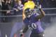 Baltimore Ravens tackle Eugene Monroe waves as he introduced before a NFL football game against the Cincinnati Bengals in Baltimore, Sunday, Nov. 10, 2013. (AP Photo/Nick Wass)