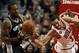 Chicago Bulls center Joakim Noah, right, loses the ball to San Antonio Spurs small forward Kawhi Leonard (2) during the first half of an NBA basketball game on Tuesday, March 11, 2014, in Chicago. (AP Photo/Andrew A. Nelles)