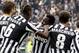 Juventus midfielder Kwadwo Asamoah, center of Ghana, celebrates after scoring during a Serie A soccer match between Juventus and Fiorentina at the Juventus stadium, in Turin, Italy, Sunday, March 9, 2014. (AP Photo/Massimo Pinca)