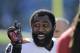 Tampa Bay Buccaneers' Darrelle Revis clowns around with teammates during warm ups before an NFL football game against the Carolina Panthers in Charlotte, N.C., Sunday, Dec. 1, 2013. The Panthers won 27-6. (AP Photo/Bob Leverone)