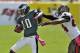 Philadelphia Eagles wide receiver DeSean Jackson (10) is shoved out of bounds by Tampa Bay Buccaneers cornerback Darrelle Revis (24) during the second quarter of an NFL football game Sunday, Oct. 13, 2013, in Tampa, Fla. (AP Photo/Steve Nesius)