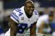 Dallas Cowboys defensive end DeMarcus Ware (94) smiles as he talks with teammates while stretching during warm ups before an NFL football game against the Washington Redskins, Sunday, Oct. 13, 2013, in Arlington, Texas. (AP Photo/Tim Sharp)