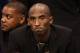 PHOENIX, AZ - JANUARY 15: Kobe Bryant #24 of the Los Angeles Lakers watches from the bench during the NBA game against the Phoenix Suns at US Airways Center on January 15, 2014 in Phoenix, Arizona. NOTE TO USER: User expressly acknowledges and agrees that, by downloading and or using this photograph, User is consenting to the terms and conditions of the Getty Images License Agreement. (Photo by Christian Petersen/Getty Images)