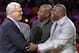 FILE - In this Oct. 27, 2009, file photo, Los Angeles Lakers coach Phil Jackson, left, shakes hands with former Laker Magic Johnson, right, before an NBA basketball game in Los Angeles. Johnson sold his small ownership stake in the Lakers to Dr. Patrick Soon-Shiong on Monday, Oct. 18, 2010. Johnson bought shares representing about 4.5 percent of the Lakers in June 1994 for a reported $10 million. Johnson said the sale was strictly a