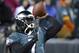 Philadelphia Eagles' Michael Vick warms up before an NFL wild-card playoff football game against the New Orleans Saints, Saturday, Jan. 4, 2014, in Philadelphia. (AP Photo/Matt Rourke)